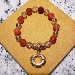 Carnelian semi-precious faceted bead and irridescent glass stretch brace…
